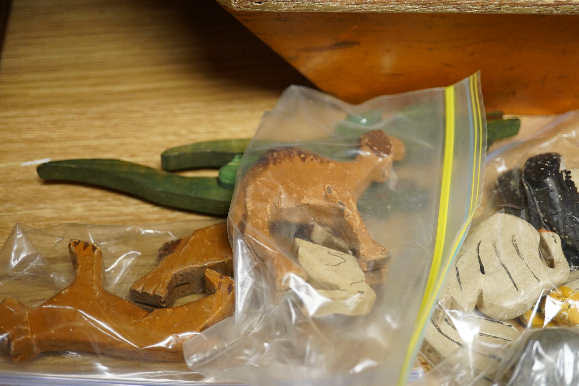 A First World War ‘War Relief Toy Work’ painted pine Noah's Ark with a quantity of carved and painted wooden animals, the ark with hinged lid, label pasted to the inside of the lid stating; Made in England, with a biblic